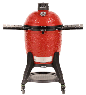 Red ceramic Kamado Joe grill on a black rolling cart with side shelves