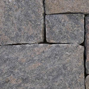 Close-up of gray granite squared stone wall texture