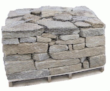 Bundle of rough-cut Maine granite wall stone wrapped in wire netting on a pallet