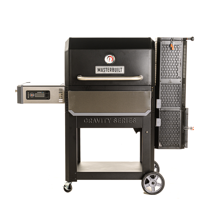 Black Masterbuilt Gravity Series smoker and grill on a wheeled cart