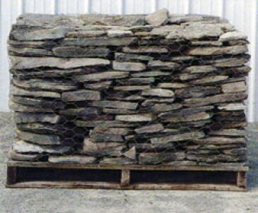 Bundle of flat natural fieldstone 1 to 3 inches thick wrapped on a pallet