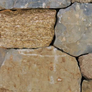 Close-up of tan and cream squared veneer stone wall texture