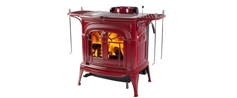 Small red enamel cast-iron wood stove with nickel trim, product photo